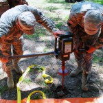 PIERRE PART, La. -- Louisiana National Guard Soldiers Pvt. Paris Hammond of Hammond, La., and Spc. Scylar Miller of Lafayette, La., work to assemble Tiger Dams to help prevent backwater flooding in Pierre Part, La., May 14, 2011. (U.S. Army photo by 2nd Lt. Mark J. Deshotels, 241st Mobile Public Affairs Detachment/Released)