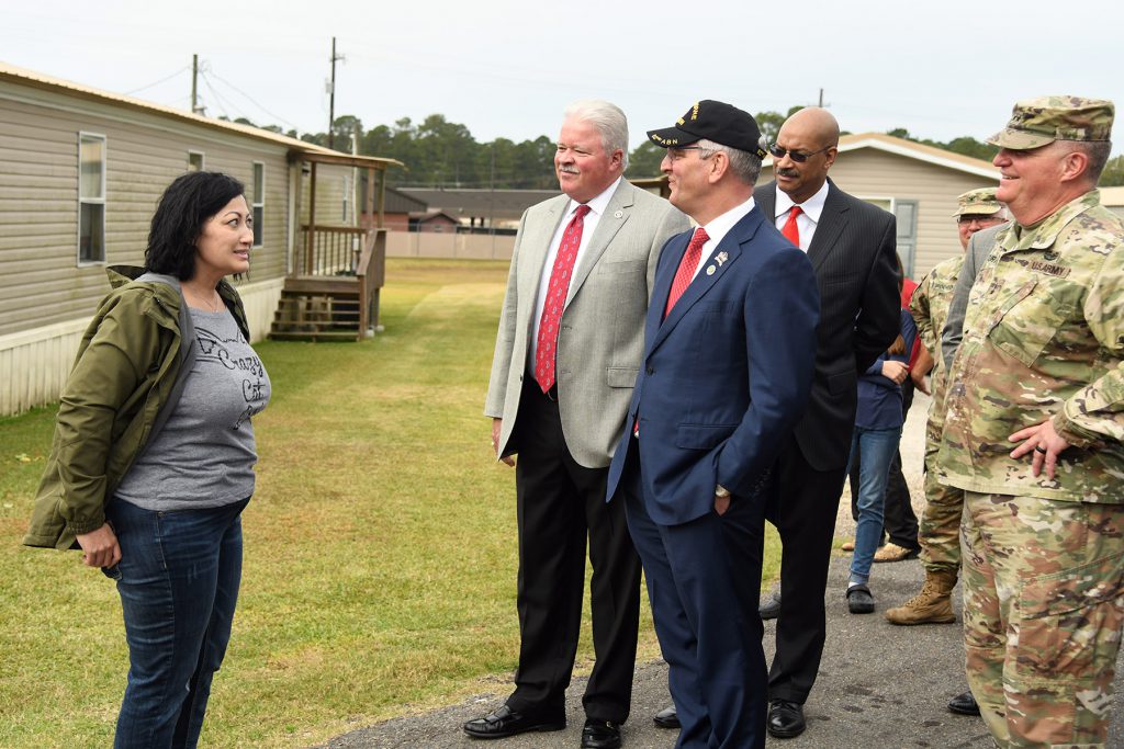 Louisiana Gov. John Bel Edwards talks with a resident of Camp Beauregard in Pineville, Louisiana, Nov. 11, 2019. Edwards pledged $10 million to a project that will replace the mobile homes that were brought in to house displaced families after Katrina with permanent housing. (U.S. Army National Guard photo by Staff Sgt. Garrett L. Dipuma)