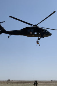 Soldiers from G Company 2-238th General Support Aviation Battalion, as part of Task Force Dragon while deployed to Afghanistan, conduct day hoist training in Afghanistan, Mar. 18, 2020. The training was done to comply with Army aviation regulations regarding rated and non-rated crewmember requirements. (U.S. Army National Guard courtesy photo)