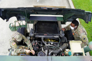 The Louisiana National Guardsmen with the 1-141 Field Artillery Battalion prepare in New Orleans ahead of Hurricane Ida, Aug. 27, 2021. In addition to 64 high-water vehicles and 61 rescue boats prepped and staged across south Louisiana, the LANG has 13 helicopters ready to support search and rescue, evacuation and recon missions as needed. (U.S. Army National Guard photo by Spc. Duncan Foote)