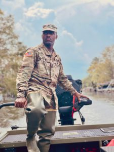 While on a high-water boat mission to conduct wellness checks on residents in Maurepas, Louisiana, Spc. Gemini Jack (pictured) and Spc. Jacob Hawkins from the 1020th Engineer Vertical Construction Company, 527th Engineer Battalion, 225th Engineer Brigade rescue an elderly cancer patient, Sept. 1. (Courtesy photo)