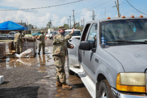 Airmen from the 159th Fighter Wing, Louisiana Air National Guard, manned Points of Distribution (POD) sites distributing food, water, ice and tarps to residents in Raceland, Louisiana, Sept. 1, 2021. POD members adhered to COVID-19 protocols while ensuring those in need received essential supplies to help alleviate the burden following Hurricane Ida. (U.S. Air National Guard photo by Staff Sgt. Ryan J. Sonnier)