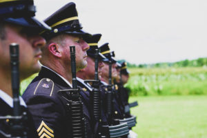 A Louisiana National Guard Military Funeral Honors Team performs a rifle detail, July 1, 2021, during a military flyover of a fallen soldier’s ceremony. Over the last year alone, the team proudly rendered honors at more than 1,500 veterans’ funerals, honoring them for their service. (U.S. Army National Guard photo by Sgt. 1st Class Denis Ricou)