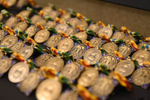 Awards waiting to be handed out to Louisiana National Guard Task Force COVID members during a ceremony at the State Aviation Command in Hammond, Louisiana Dec. 2, 2021. The ceremony was one of a series of ceremonies across the state to honor more than 850 of LANG service members, recognizing their efforts in assisting the citizens of Louisiana during COVID-19 recovery operations. (U.S. Air National Guard photo by Master Sgt. Toby M. Valadie)